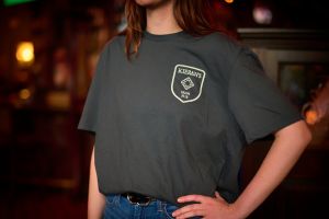 Front view of pub swag grey t-shirt with logo